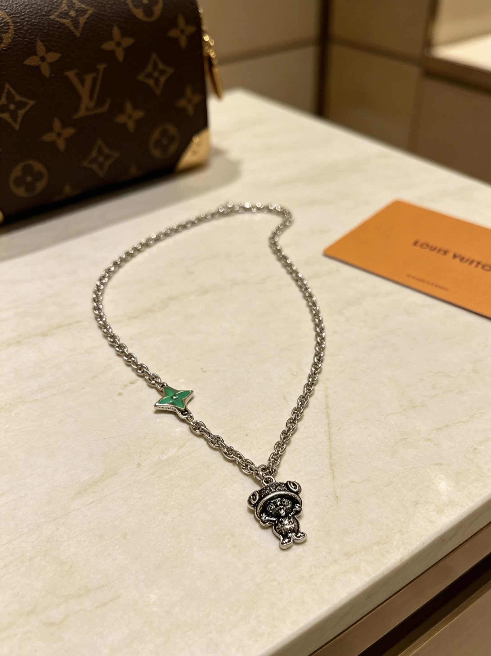Louis Vuitton Silver Tone Necklace with Green Enamel and Monogram Bear Charm